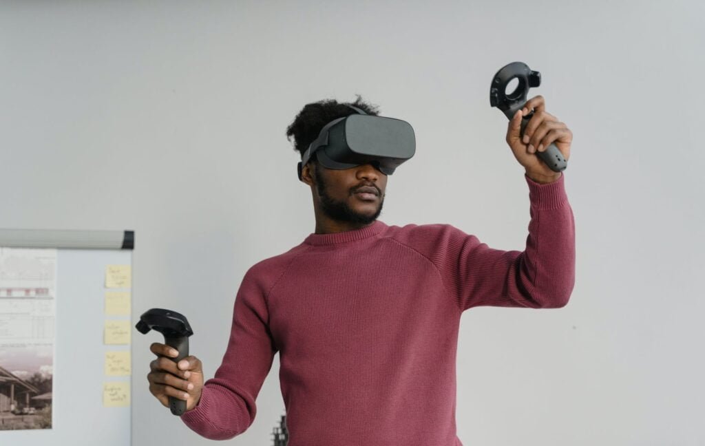 a man playing with virtual reality games